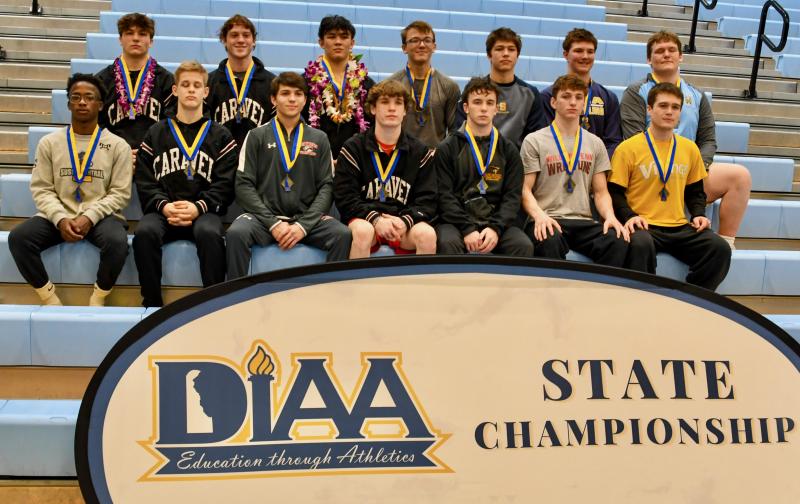 State champions by weight class are in back (l-r) John Antonio, 152, Caravel; Alex Poore, 160, Caravel; Nicholas Hall, 170, Caravel; Justin Griffith, 182, Sanford; Max Agresti, 195, Salesianum; Tyler August, 220, DMA; and Lucas Ruppert, 285, Cape Henlopen. In front are Malachi Stratton, 106, Sussex Central; Eddie Radecki, 113, Caravel; Gabe Giampietro, 120, Smyrna; Luke Poore, 126, Caravel; Jack Thode, 132, Milford; Danny Sinclair, 138, William Penn; and Mikey Frederick, 145, Cape Henlopen. DAVE FREDERICK PHOTOS